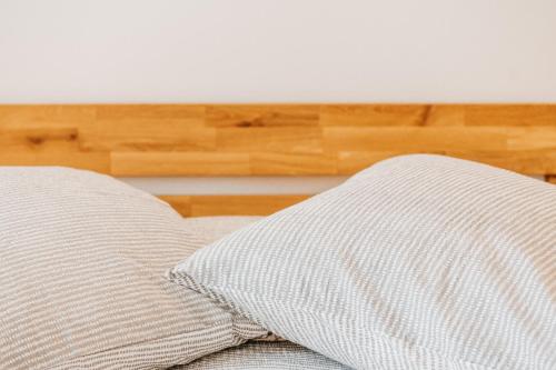 a pillow sitting on top of a bed at Bijou in Selma