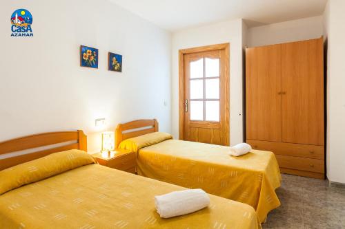 Ліжко або ліжка в номері Apartamentos Mare Nostrum Casa Azahar