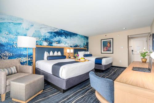a hotel room with two beds and a couch at Best Western Plus Marina Gateway Hotel in National City