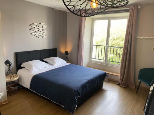 Кровать или кровати в номере La Maison du Bonheur