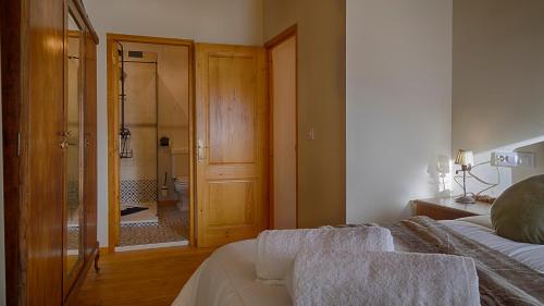 Ein Bett oder Betten in einem Zimmer der Unterkunft Saplan Real Estate VILAMOS