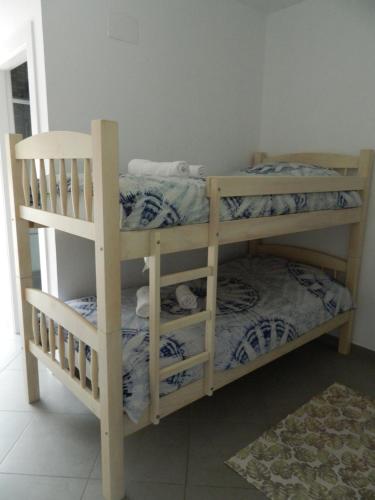a couple of bunk beds in a room at Hotel Restaurant Baladrar in Benissa