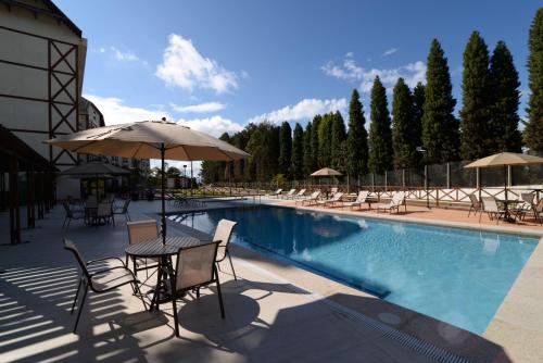 Bazén v ubytování Vista Azul Apart Hotel - Vista Pinheiros nebo v jeho okolí