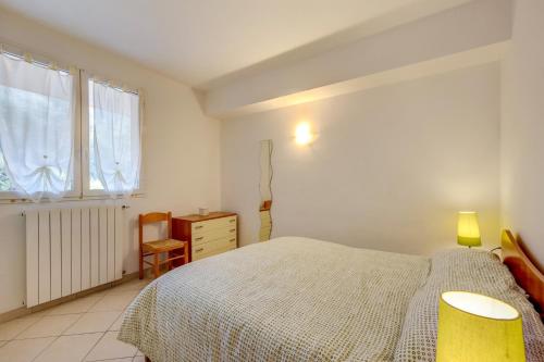 Ένα ή περισσότερα κρεβάτια σε δωμάτιο στο Appartamento Succu La Taggiasca