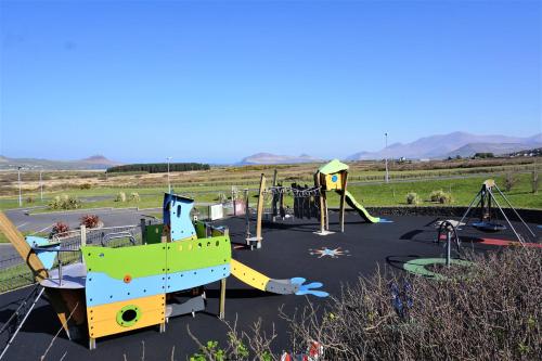 a park with a playground with a slide at Hotel Ceann Sibeal in Dingle
