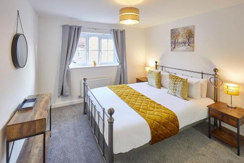 a bedroom with a large bed and a window at Host & Stay - Redsky House in Whitby