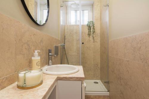 a bathroom with a sink and a shower at Charming Apartment in Private Condominium at Graça in Lisbon