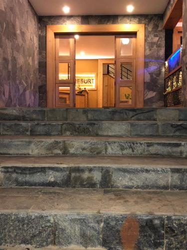 a set of stairs in front of a store at 3 Arch Resort Ella in Ella