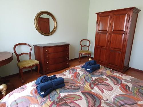 Cama ou camas em um quarto em Casa Ninì