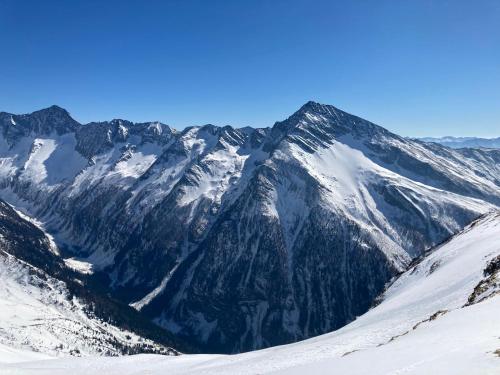 a snow covered mountain range with snow on it at Haus Seebach in Mallnitz
