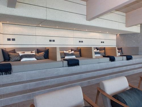 a waiting room with couches and chairs at Hotel de Charme Laveno - Luxury all Inclusive in Laveno-Mombello