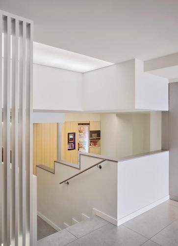 a staircase in a building with white walls at Hostal Lami in Esplugues de Llobregat