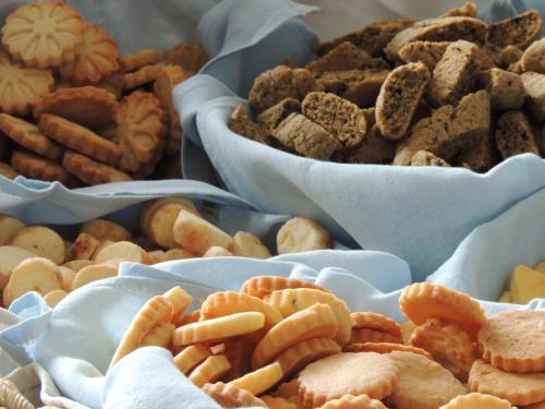 a table with three bowls of different types of snacks at Domus Petrae - Ripatransone in Ripatransone