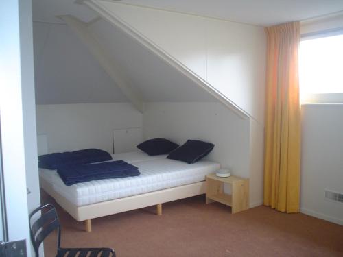Postel nebo postele na pokoji v ubytování Villa de Molenhof