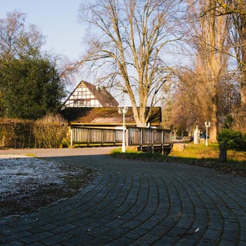 a brick road with a house in the background at Hotel Saltenhof in Hörstel
