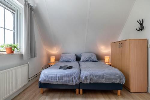 Кровать или кровати в номере Natuurhuisje ‘t Oetzicht