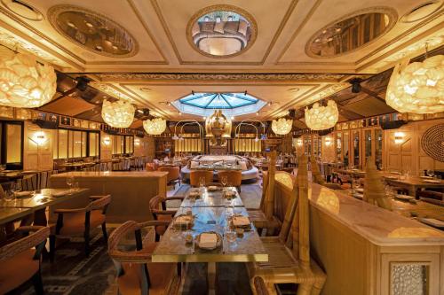 a restaurant with a long table in the middle at BLESS Hotel Madrid - The Leading Hotels of the World in Madrid