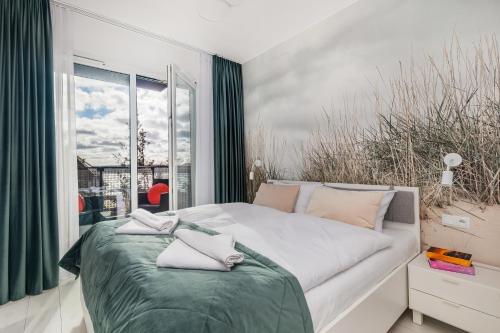 Posteľ alebo postele v izbe v ubytovaní Seaside Apartamenty - Olimpijska 2 Mielno - Sauna & Fitness & Parking - w cenie pobytu