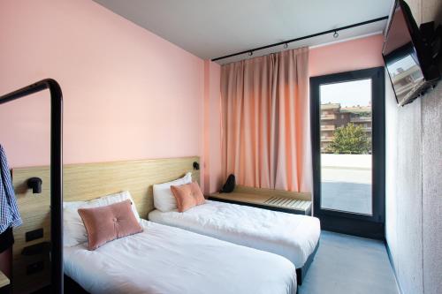 Una cama o camas en una habitación de Ibis Styles Roma Aurelia