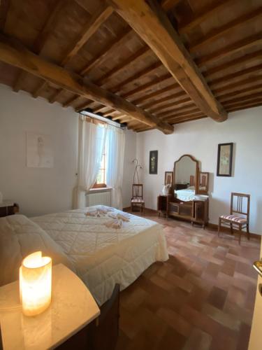 Ένα ή περισσότερα κρεβάτια σε δωμάτιο στο Agriturismo Casallario