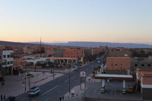 a view of a city with a street and buildings at Dromadaire Gourmand in Zagora