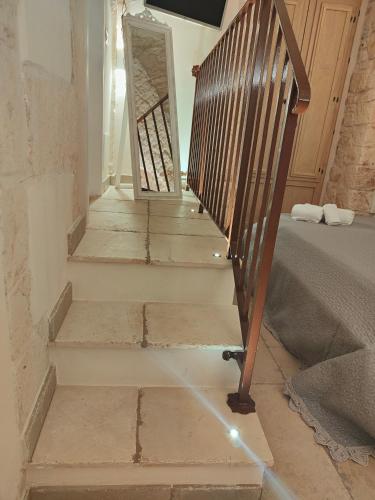 a set of stairs in a room with a stair case at Il Balcone di Anna - Luxury Homes in Ceglie Messapica