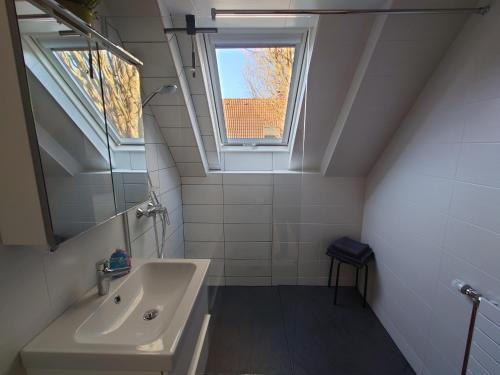 a bathroom with a sink and a window at Fewo Berlin Tempelhof in Berlin