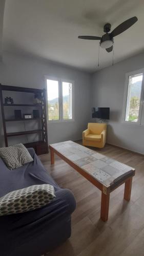 a living room with a couch and a coffee table at Sparta Filoxenia House in Xirokámbion