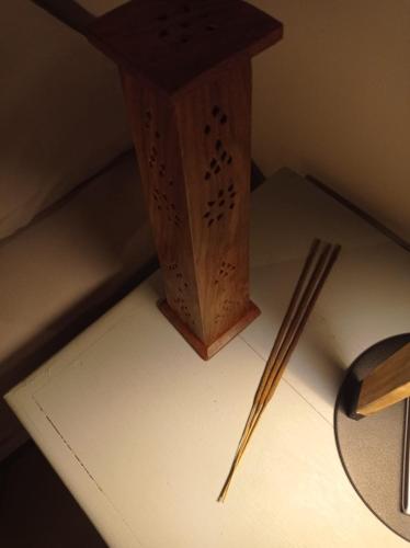 a table with a wooden box and chopsticks on it at 3B Wellness Hotel & Hostel Adults Only in Playa del Carmen