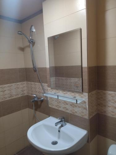a bathroom with a sink and a mirror at Hotel Zora in Kranevo