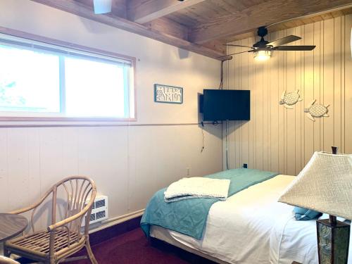 Ένα ή περισσότερα κρεβάτια σε δωμάτιο στο Breakers Boutique Inn