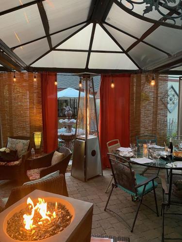 a patio with a fire pit in the middle at Coastal Hideaway in Carlsbad