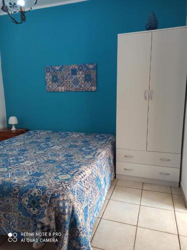 Postel nebo postele na pokoji v ubytování Sicilia Bedda isolotto