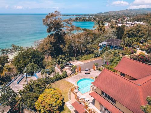 an aerial view of a house and the ocean at La Jolie - Luxury Ocean View Villa in Black Rock