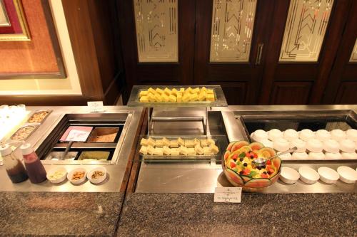 a buffet line with different types of food on display at Taj Mahal Hotel Abids in Hyderabad
