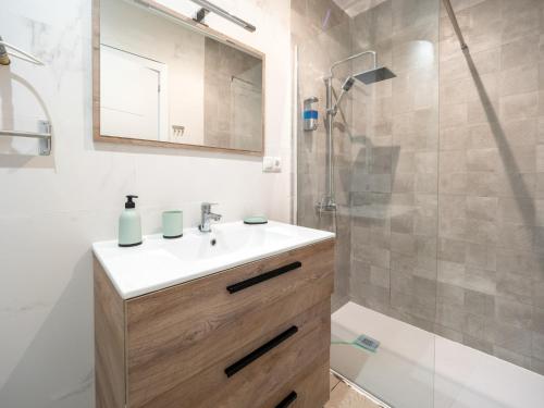 a bathroom with a sink and a shower at Luxury Suite Fuengirola 1 in Fuengirola