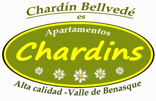 a green sign with white flowers on it at Chardín Bellvedé-Apartamentos Chardins in Cerler