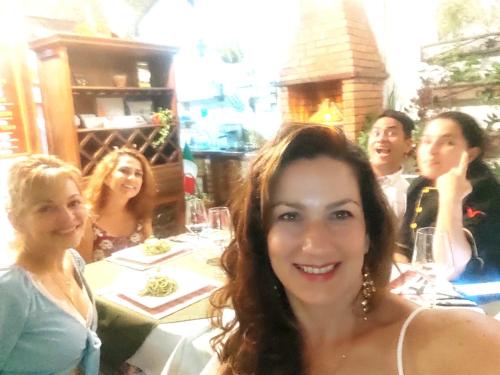 a group of women sitting at a table in a restaurant at Giron Chill Out Hotel Boutique in Girón