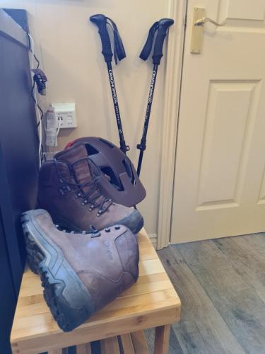 a pair of ski poles and a glove on a bench at The Shambles by Spires Accommodation A Boho styled place to stay just 3 miles from Birches Valley visitors Centre Cannock Chase in Rugeley