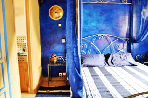 Una cama o camas en una habitación de Riad Anma