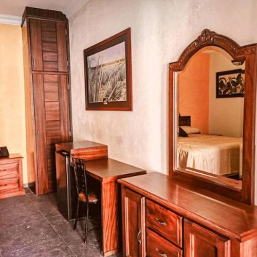 Кровать или кровати в номере Hotel Delicias Tequila