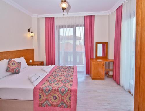 Cama o camas de una habitación en Gumus Konak