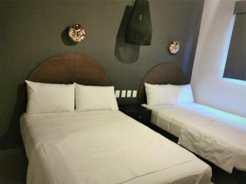 En eller flere senge i et værelse på HM HOTEL EXPRESS