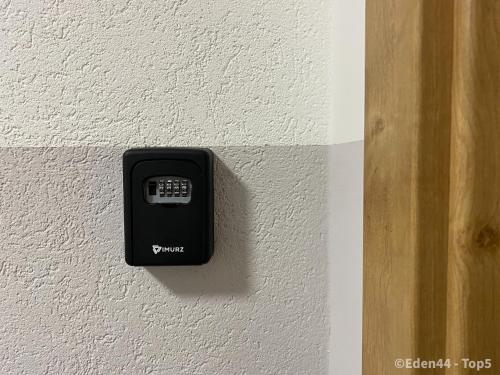 a black outlet on a white wall at Eden 44 - Top 5 in Tamsweg