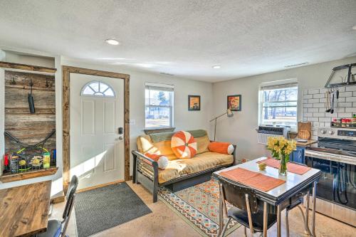a living room with a couch and a table at Kid-Friendly House about 8 Mi to Cedar Rapids! in Cedar Rapids