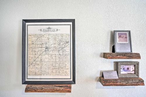 a framed map on a wall with two picture frames at Kid-Friendly House about 8 Mi to Cedar Rapids! in Cedar Rapids