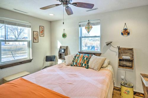 a bedroom with a bed and a ceiling fan at Kid-Friendly House about 8 Mi to Cedar Rapids! in Cedar Rapids