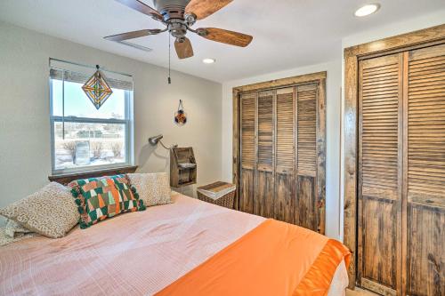 a bedroom with a bed and a ceiling fan at Kid-Friendly House about 8 Mi to Cedar Rapids! in Cedar Rapids