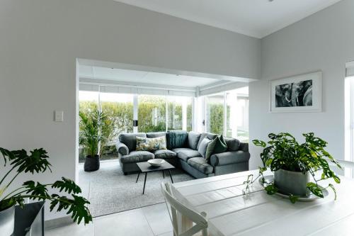 a living room with a couch and a table at Kingswood Manor No.17 in George