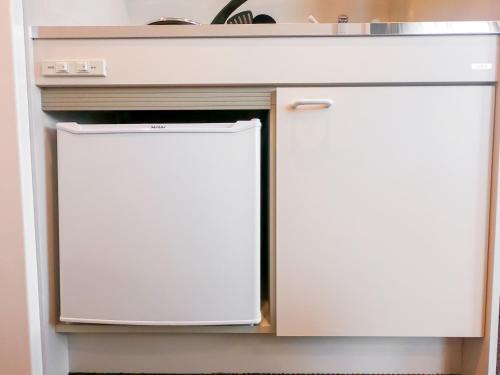 two refrigerators in a kitchen under a counter at Hotel S-Presso Central - Vacation STAY 9443 in Osaka